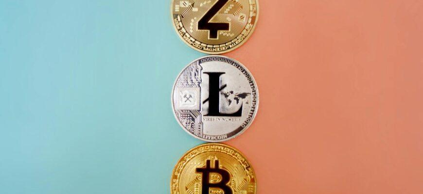 Colorful display of Zcash, Litecoin, and Bitcoin coins on gradient background.