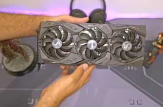 a person holding a computer fan in their hand